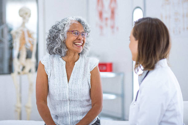 Older adult talking with a healthcare professional